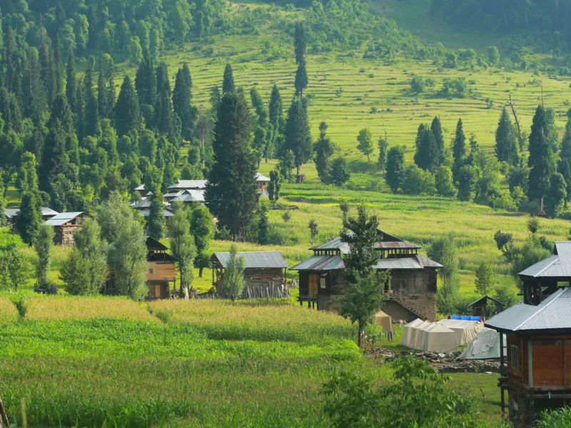 Wooden houses scattered across the meadows of Arang Kel