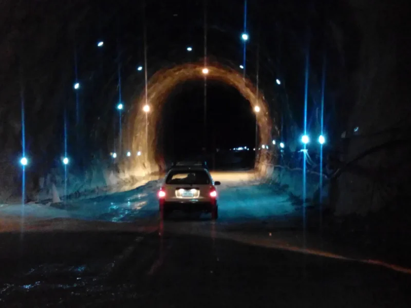 A car driving through the Lowari Tunnel towards Chitral