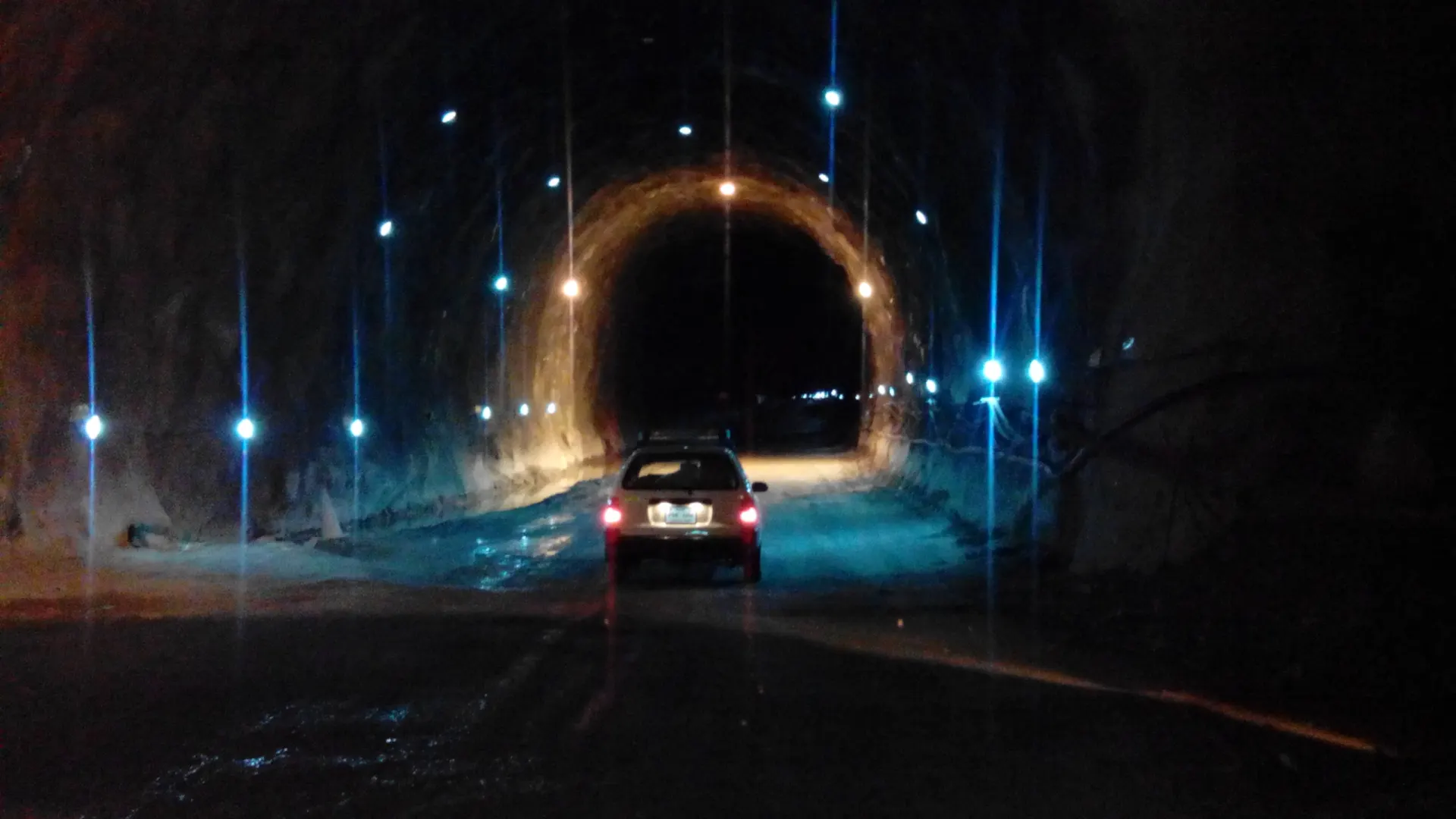 A car driving through the Lowari Tunnel towards Chitral