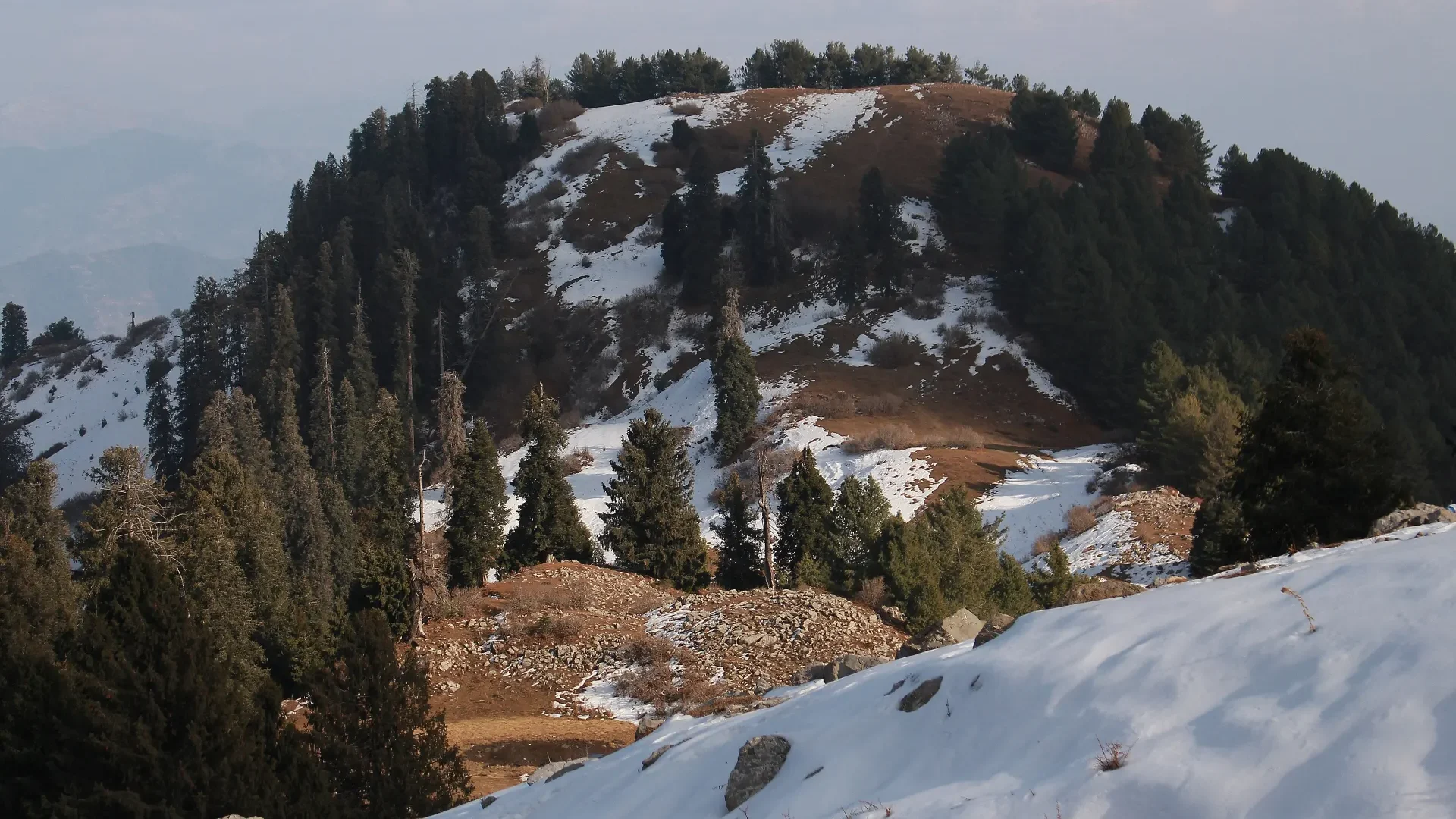 Snow on the slopes of Mushkpuri near Nathia Gali