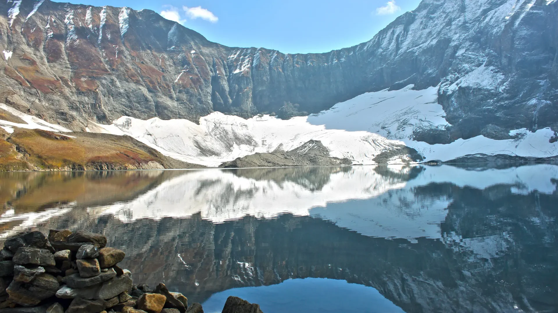 Ratti Gali Lake reflecting snow slopes above the Neelum Valley
