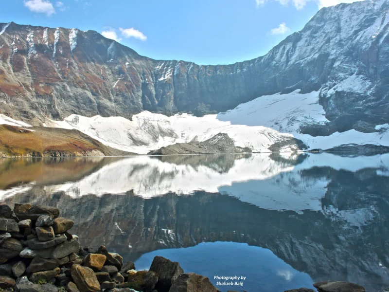 Ratti Gali Lake reflecting snow slopes above the Neelum Valley