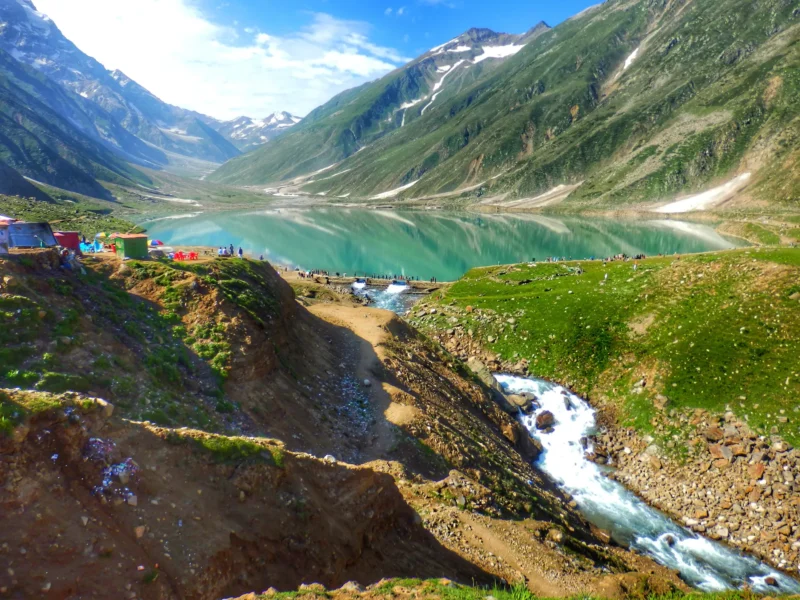Lake Saiful Muluk in summer with the stream flowing towards Naran