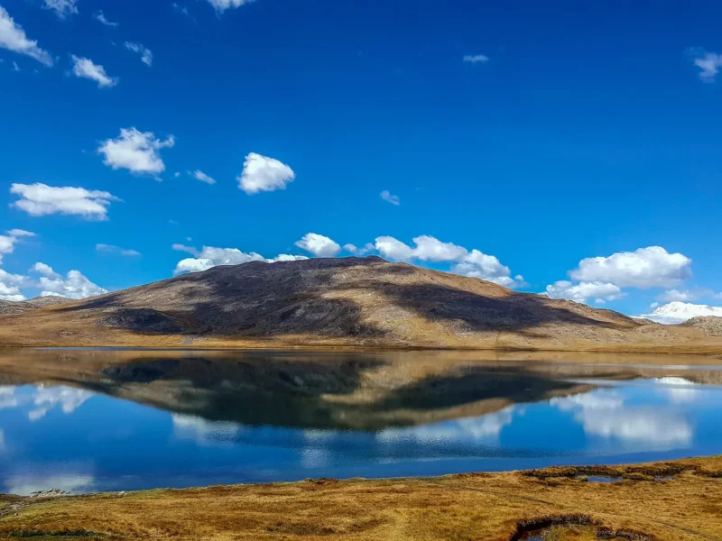Sheosar Lake on the Deosai Plateau with mirror reflections