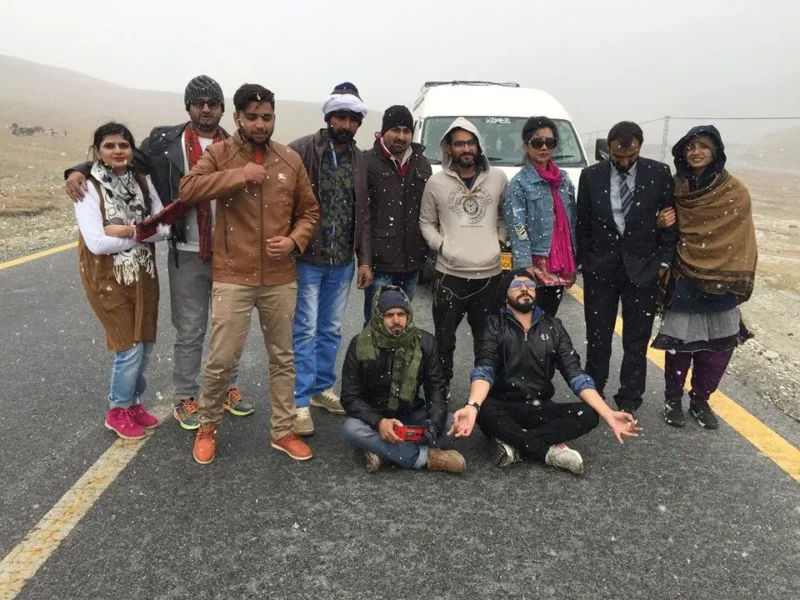 A Venture Tours group stopping on a mountain highway
