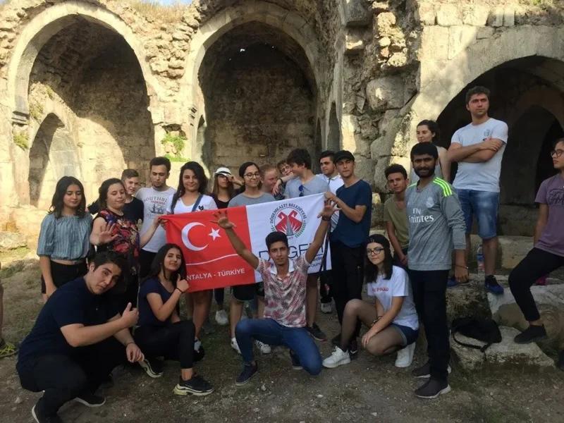 An international group with The Venture Tours at historic ruins