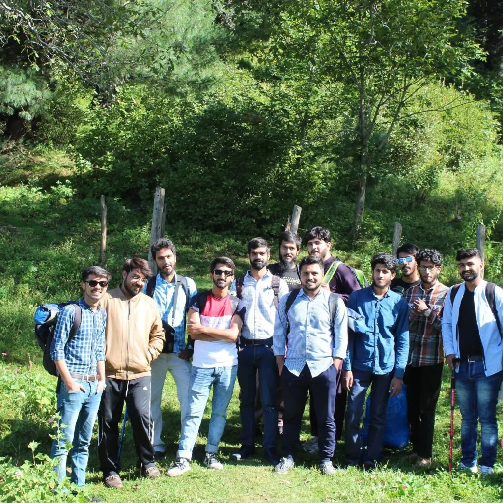 Travellers on a Venture Tours group trip in a green valley