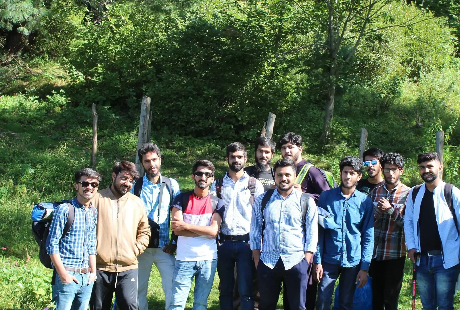 Travellers on a Venture Tours group trip in a green valley