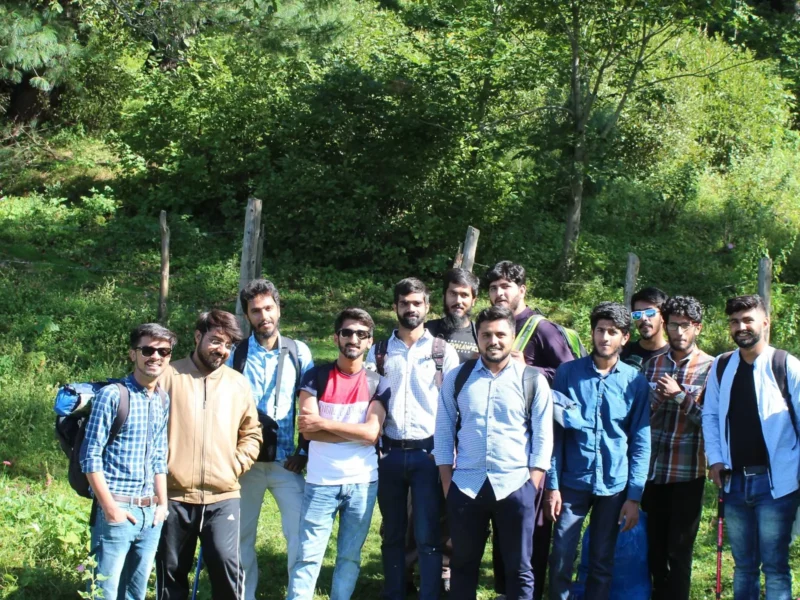 Travellers on a Venture Tours group trip in a green valley
